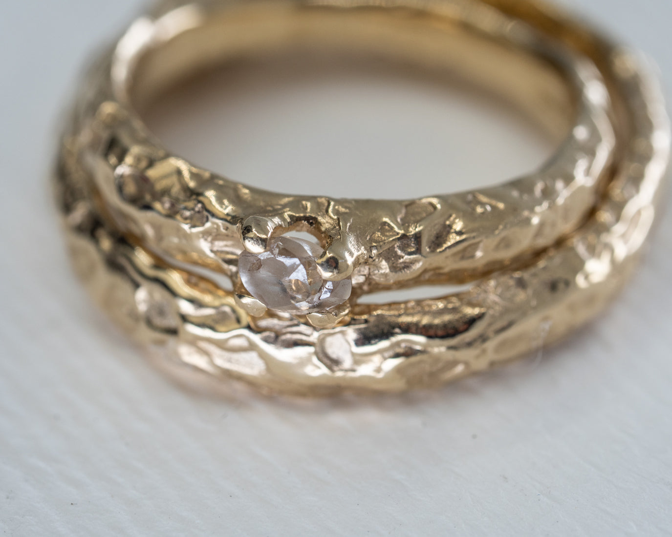Organic shape of wedding bands with ethical ocean diamonds and recycled gold