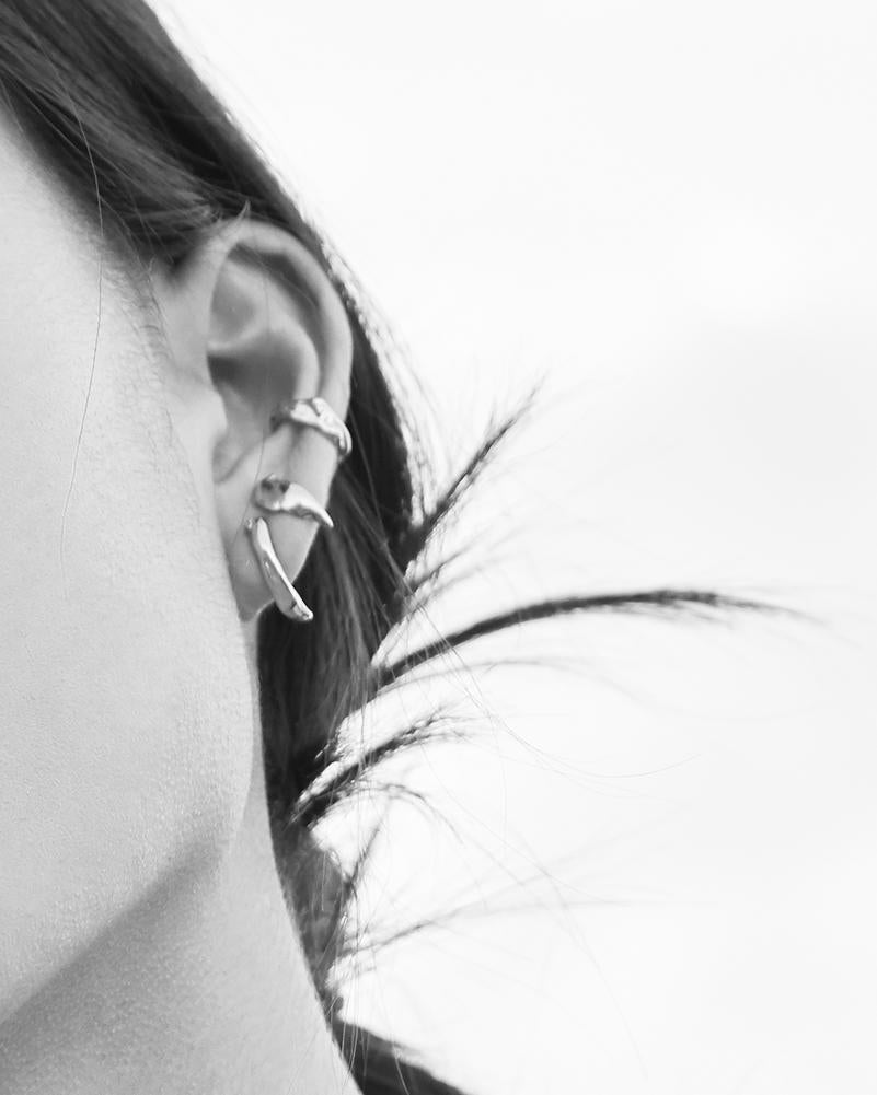 silver stud earrings worn with mini ear cuffs